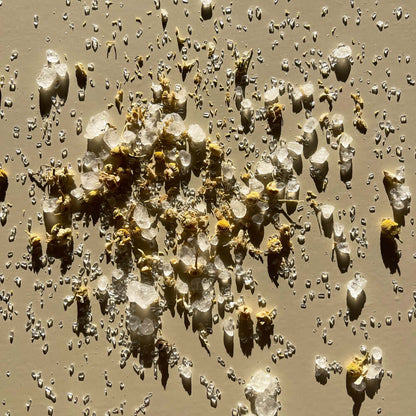 Nourish magnesium bath salts product on a surface background.