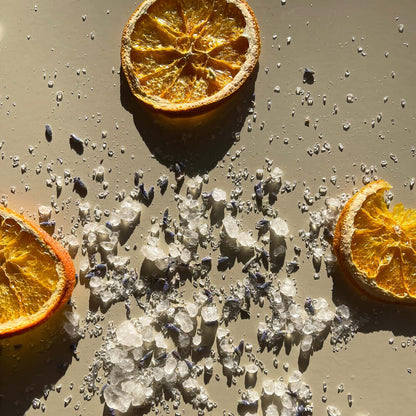Surrender magnesium bath salts product on a beige background surface.